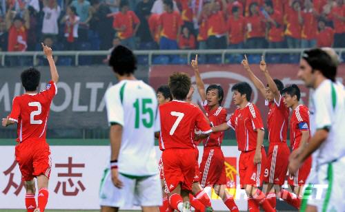 6月14日，中国队球员在比赛中庆祝进球。当日，在2010年南非世界杯足球赛亚洲区预选赛中，中国队主场迎战伊拉克队。